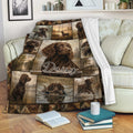 Boykin Spaniel throw blanket displayed on a sofa with brown hunting dog collage artwork