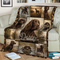 Rustic Boykin Spaniel blanket draped over a sofa with hunting dog and woodland scenes