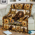 Boykin Spaniel throw blanket draped over a sofa with sunflower and countryside artwork