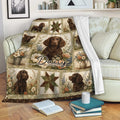 Boykin Spaniel blanket displayed on a sofa with brown dog portraits and vintage floral artwork