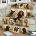 Close view of a Boykin Spaniel throw blanket featuring a central dog portrait and garden flowers