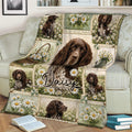 Floral Boykin Spaniel throw blanket styled across a sofa with detailed dog portraits