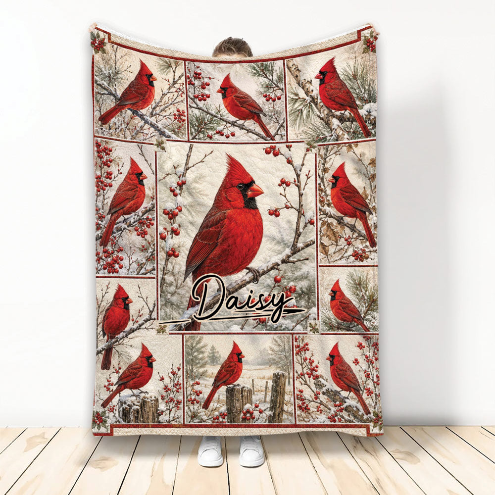 Cardinal throw blanket with red birds, winter branches, berries, and a central bird design