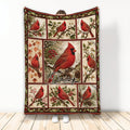 Cardinal throw blanket displayed with red bird collage artwork, berries, pinecones, flowers, and winter foliage