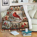Cardinal throw blanket displayed on a sofa with red birds, snowy scenes, and festive woodland details