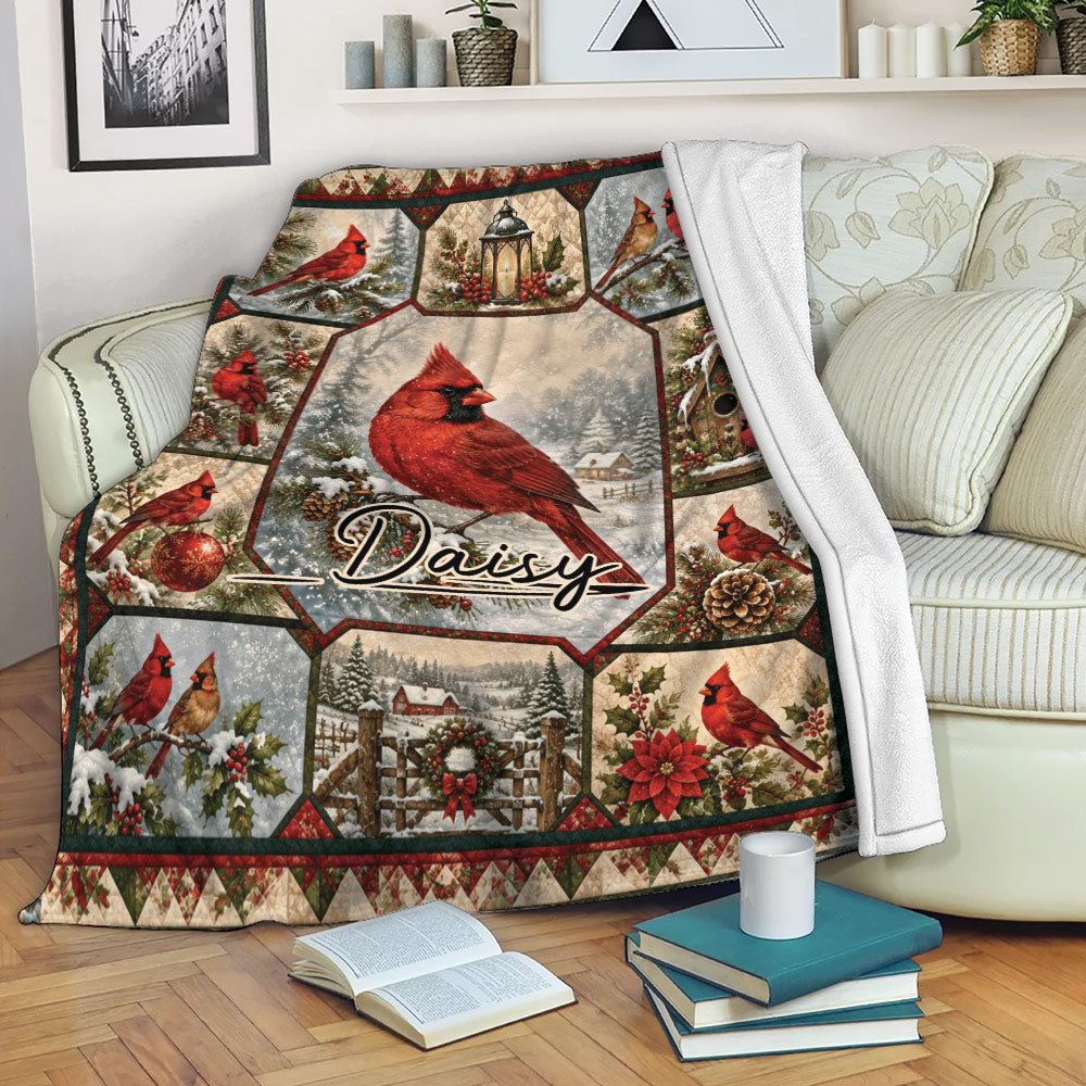 Cardinal throw blanket displayed on a sofa with red birds, snowy scenes, and festive woodland details
