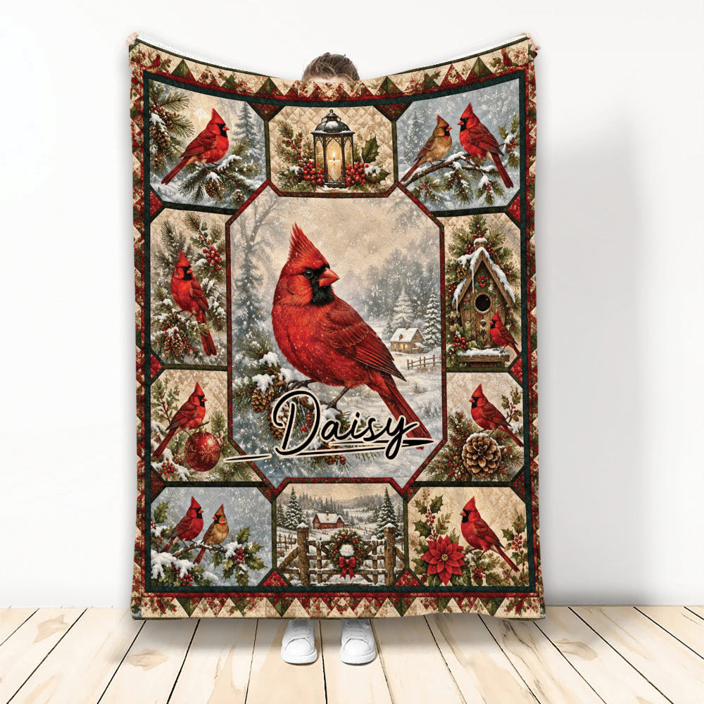 Cardinal blanket featuring red birds, snowy woodland scenes, a lantern, birdhouse, and holiday artwork
