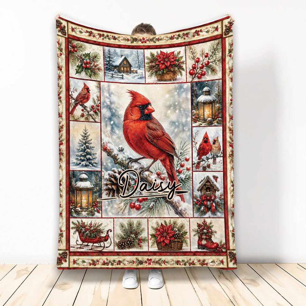 Christmas cardinal blanket featuring a red bird, snowy cabin, poinsettias, holly, lanterns, and winter decor