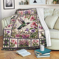Hummingbird floral throw blanket draped over a sofa in a cozy living room