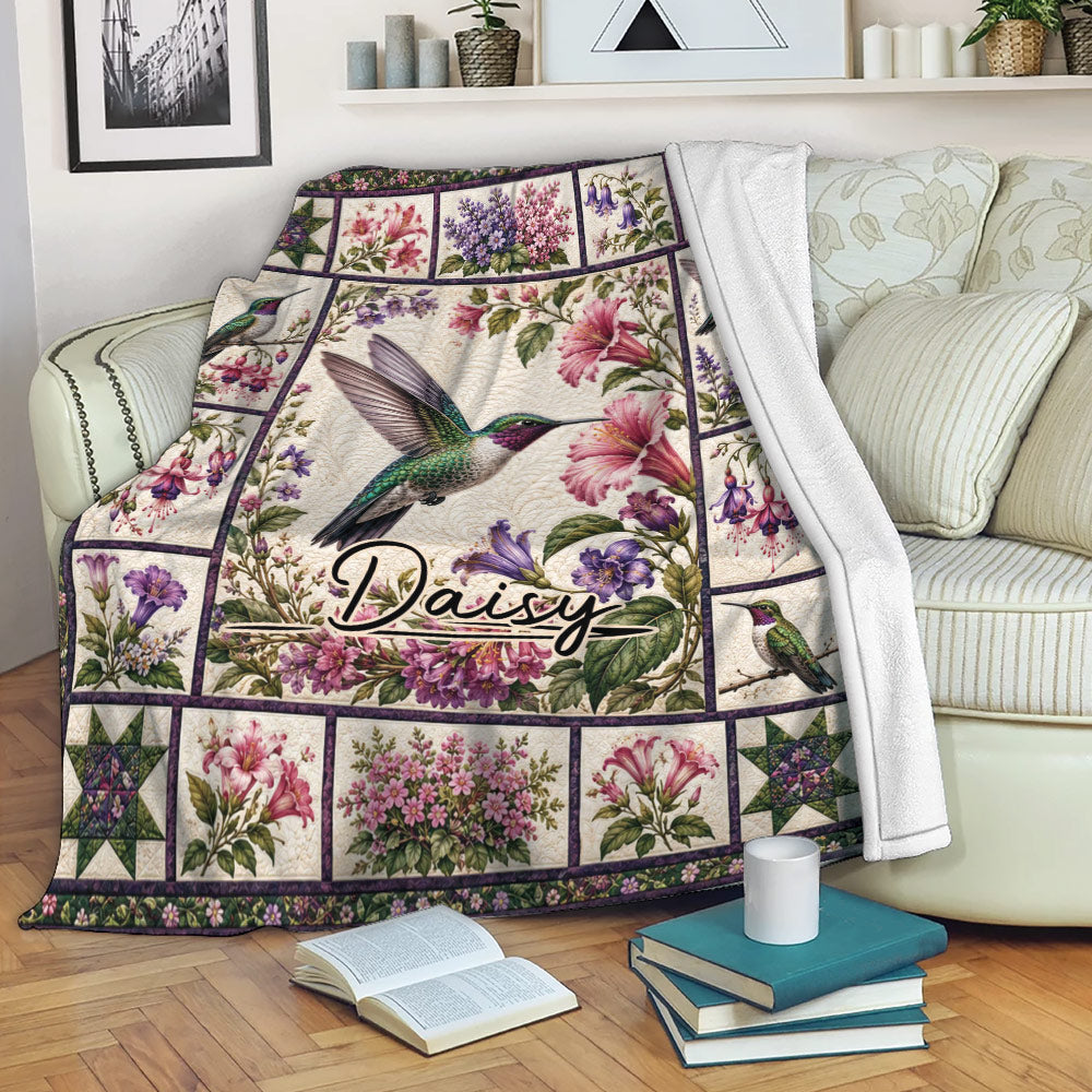 Hummingbird floral throw blanket draped over a sofa in a cozy living room