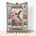 Hummingbird throw blanket with colorful flowers, botanical panels, and a detailed flying bird design
