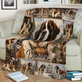 Close view of a Saint Bernard throw blanket on a sofa with woodland and mountain scenes