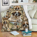 Saint Bernard blanket draped over a sofa with floral dog collage design