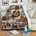 Saint Bernard Christmas throw blanket displayed on a sofa with cozy holiday dog artwork