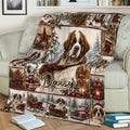 Festive Saint Bernard blanket draped across a couch with snowy woodland and Christmas scenes
