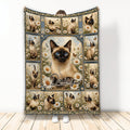 Siamese cat blanket displayed upright with blue-eyed cats, daisies, butterflies, and vintage botanical panels