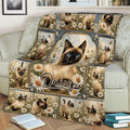 Close lifestyle view of a Siamese cat blanket featuring blue-eyed cats, daisies, and decorative vintage frames