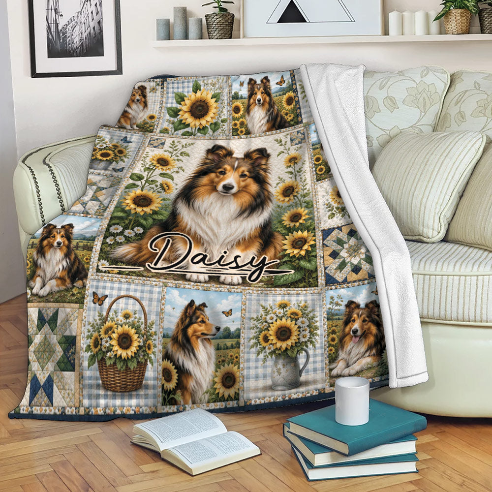 Sheltie blanket draped over a sofa, featuring sunflower scenes, pastoral artwork, and multiple dog portraits