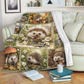 Hedgehog blanket draped over a sofa, showing floral woodland artwork in a cozy living room