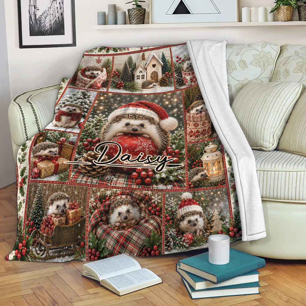 Festive hedgehog blanket draped over a sofa with Christmas greenery, presents, snow, and warm holiday artwork