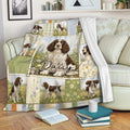 English Springer Spaniel blanket displayed on a sofa with floral panels and countryside dog scenes