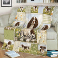 English Springer Spaniel throw blanket draped over a sofa with garden-inspired artwork