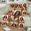 Festive English Springer Spaniel blanket draped over a sofa with Christmas portraits and holiday decorations