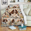 English Springer Spaniel throw blanket displayed on a sofa with floral dog artwork