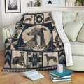 Greyhound blanket styled on a sofa with detailed dog portraits and dark geometric decorative panels
