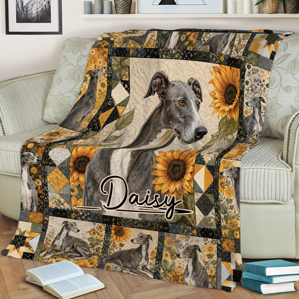 Close view of a Greyhound throw blanket on a sofa featuring sunflowers and multiple Greyhound portraits