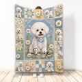 Bichon Frise blanket with white curly dogs, daisies, blue floral artwork, and patchwork-inspired accents