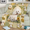 Close view of a Bichon Frise blanket featuring a fluffy white dog surrounded by sunflowers