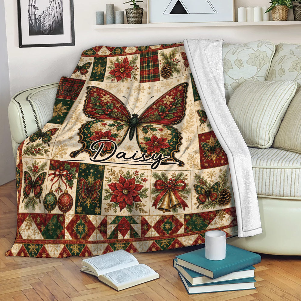 Butterfly Christmas throw blanket draped over a sofa with red, green and cream holiday artwork