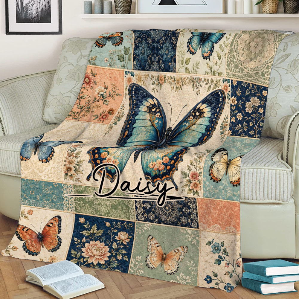 Close lifestyle view of a floral butterfly throw blanket styled across a living room sofa