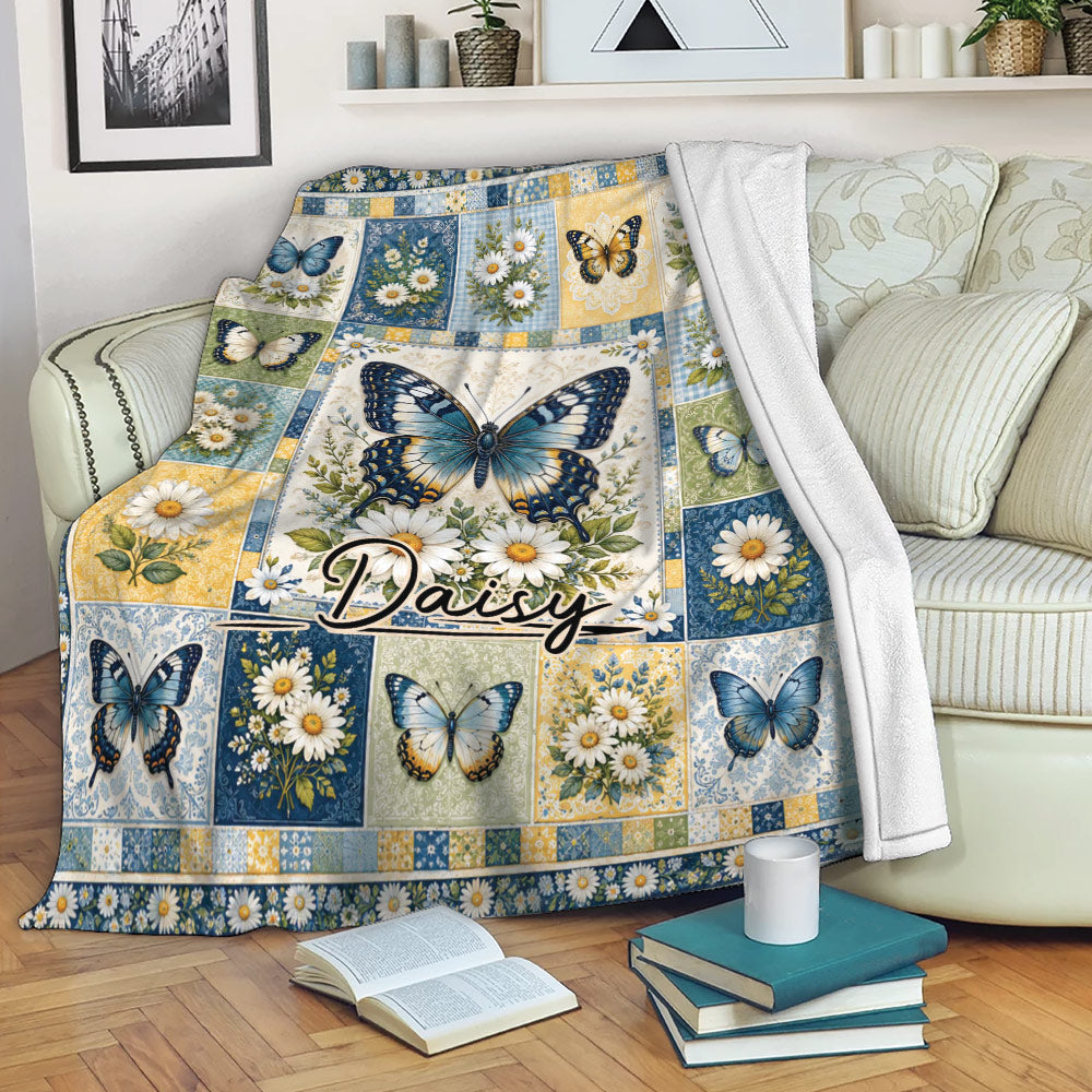 Butterfly floral throw blanket draped over a sofa with colorful daisies and garden artwork