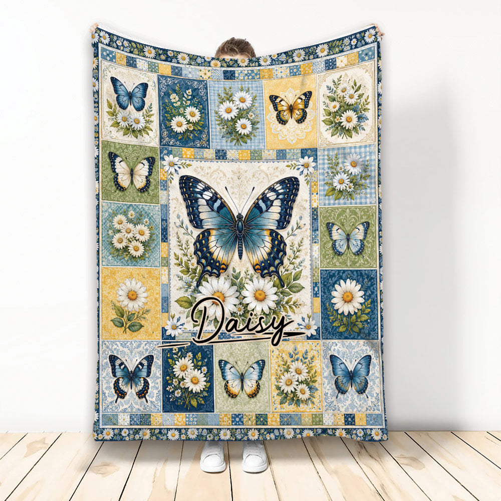 Butterfly throw blanket with blue and gold butterflies, daisies, and vintage floral panel artwork