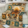 Decorative butterfly throw blanket draped across a sofa with sunflower artwork