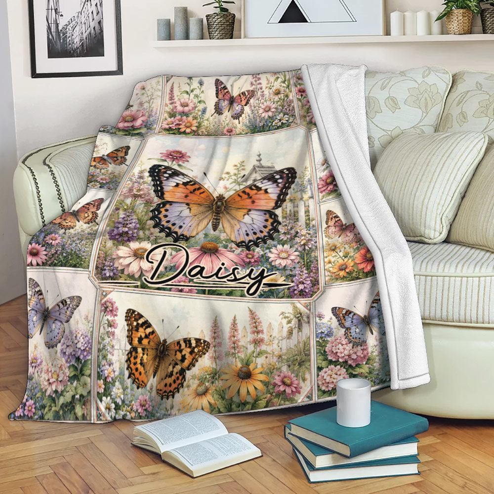 Butterfly throw blanket draped over a sofa with colorful flowers and garden artwork