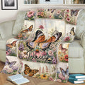 Floral butterfly throw blanket styled across a sofa with a large central butterfly