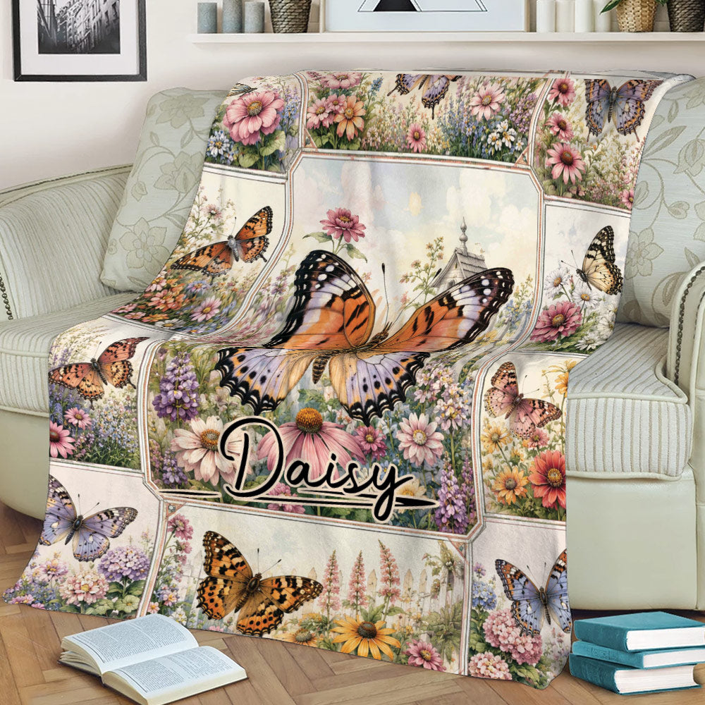 Floral butterfly throw blanket styled across a sofa with a large central butterfly