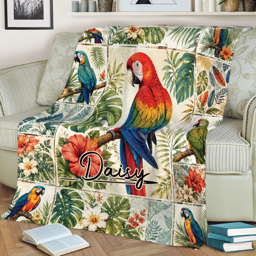 Colorful parrot throw blanket styled on a sofa with tropical foliage and floral bird artwork