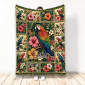 Colorful parrot blanket with tropical flowers, lush foliage, and vibrant bird artwork