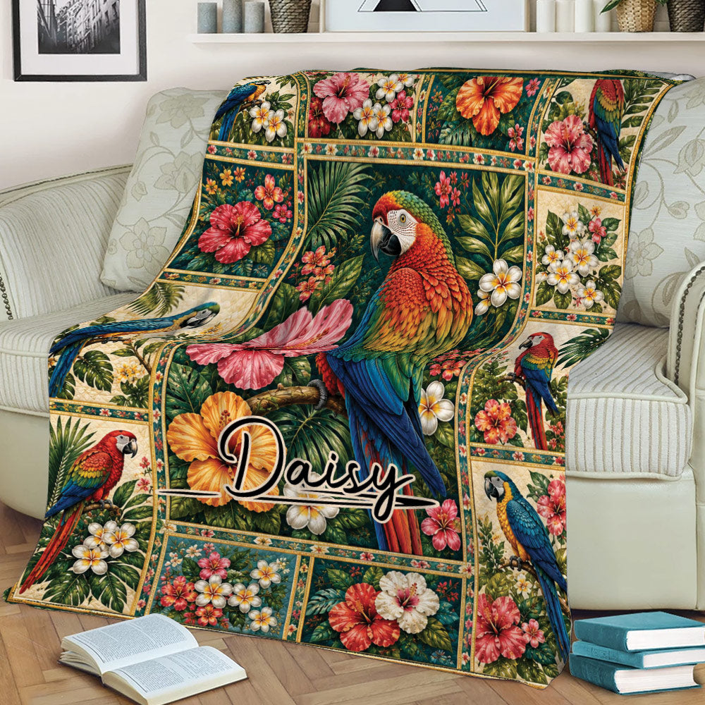 Vibrant parrot blanket displayed on a sofa with tropical flowers and lush botanical details