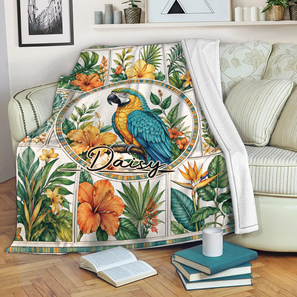 Tropical parrot throw blanket draped over a sofa with vibrant floral and leafy artwork