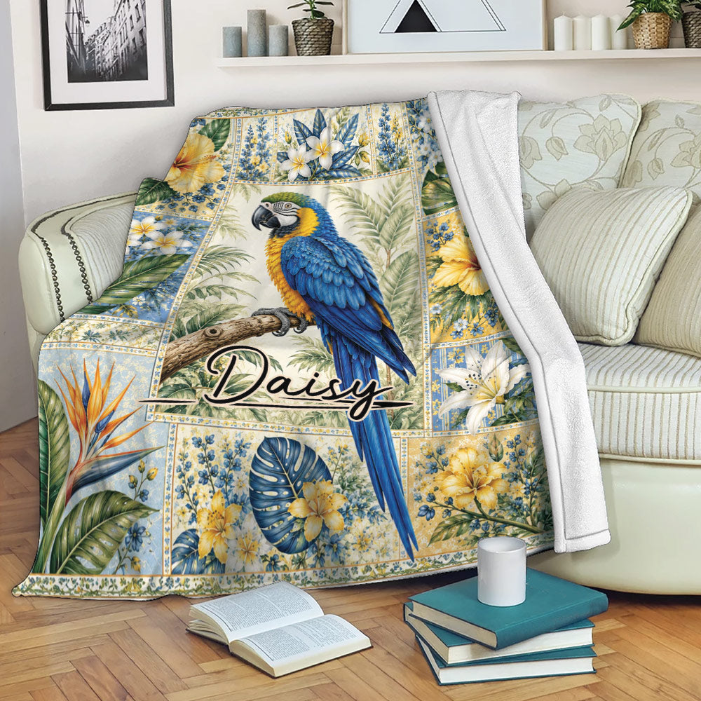 Tropical parrot throw blanket displayed on a sofa with colorful floral and leafy artwork