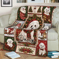 Maltese holiday throw blanket draped over a sofa with Christmas dogs, ornaments, gifts, and greenery