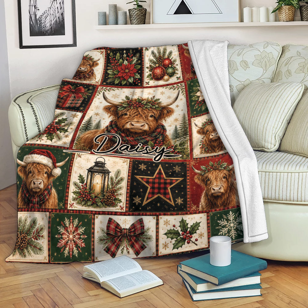 Christmas Highland Cow throw blanket draped over a sofa with festive patchwork artwork