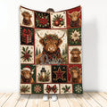Christmas Highland Cow blanket displayed upright with plaid accents, poinsettias, wreaths, and holiday motifs