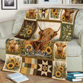Rustic Highland cow blanket displayed on a sofa with sunflower panels and countryside artwork