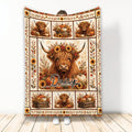 Highland cow throw blanket displayed with sunflower, pumpkin, and rustic autumn artwork